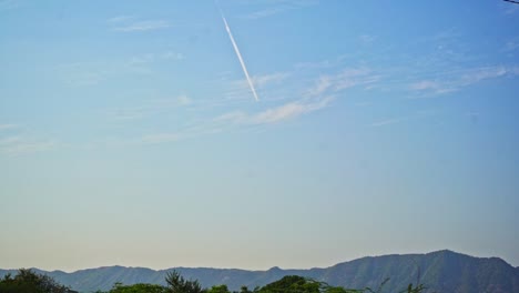 beautiful shot of a plane leaving behind contrails