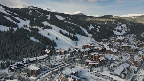 Drone-tilt-dolley-shot-over-a-winter-village-at-the-Copper-Mountain-on-a-sunny-day