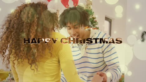 happy christmas text animation over couple dancing near christmas tree