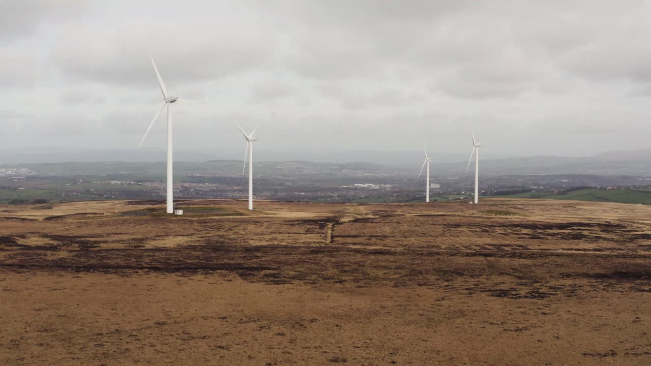 Aerial footage of wind turbines in a field