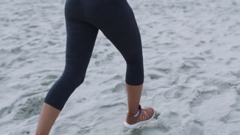 Beach,-fitness-and-feet-running-on-sand