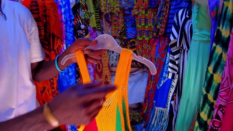 African Market Clothing Vendor Selling Colorful Tank Top