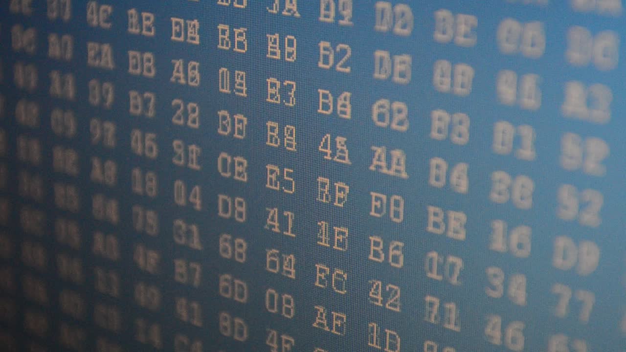 Figures on a blue background. Shooting of a binary code. Hexadecimal program code on screen. Animated background of moving binary code numbers