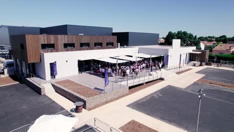 rotating shot of an inauguration of a new cooperative wine cellar in montpellier