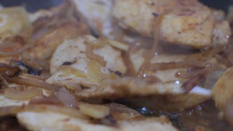 frying chicken with onions