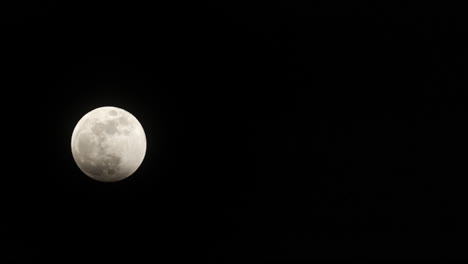 timelapse of the very beginning of the total lunar eclipse on march 14th, 2025, as shadow creeps in