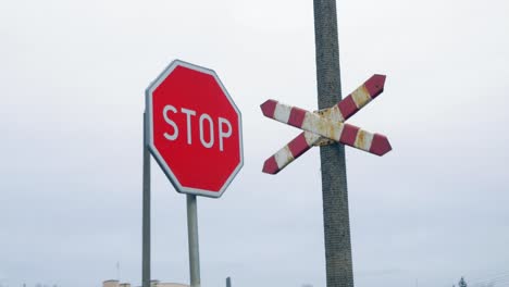 stop sign and railroad crossing gate