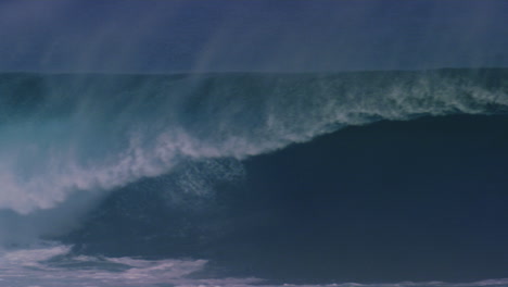 surfer bails off of wave as shortboard gets picked up by powerful water in middle of barrel, cloudbreak fiji