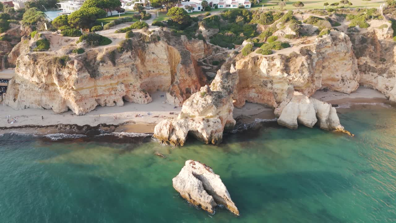 Dramatic cliffs and turquoise waters in Alvor Algarve Portugal