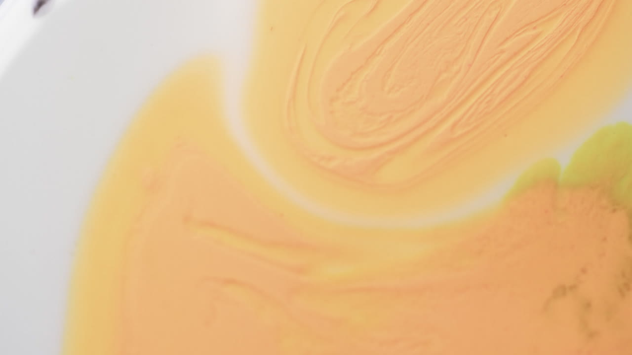 Video of close up of yellow and white ink in water with copy space ...