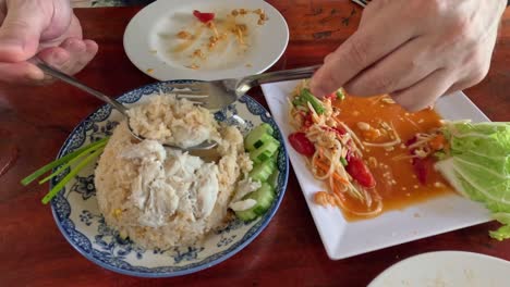 two people enjoying and sharing a meal