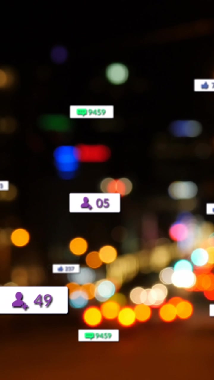Animation of social media icons and numbers over out of focus city lights