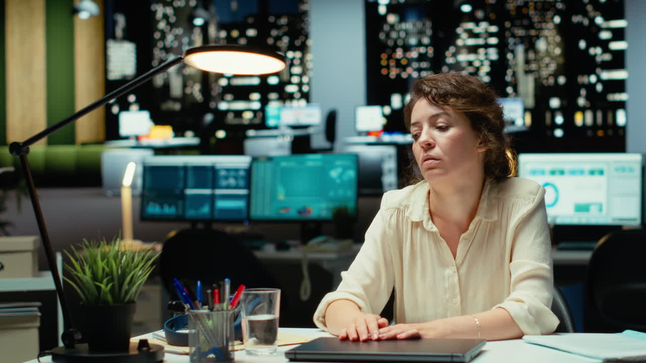 Vertical Video Employee in mental haze turning off the lamp after hours and leaving the office