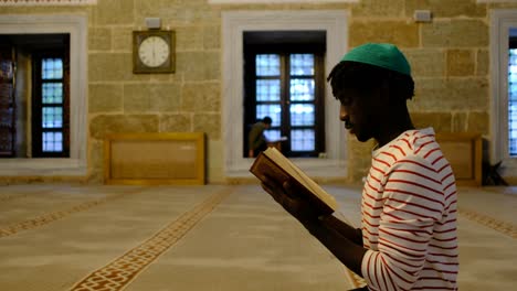 black man reading quran