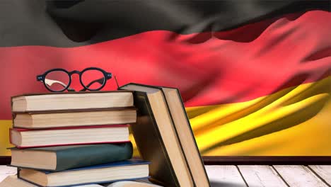 germany flag waving behind wooden table