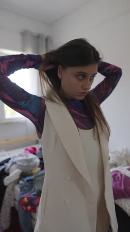 woman in a white blazer and colorful top