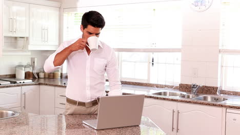 Attractive-young-man-using-laptop