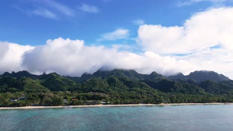 a beautiful time-lapse showcasing the mountains and coastline of rarotonga, cook islands. transition of clouds and vibrant tropical scenery under a bright blue sky