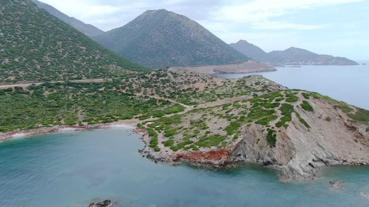 Aerial view of the coastline of Crete surrounded by clear waters