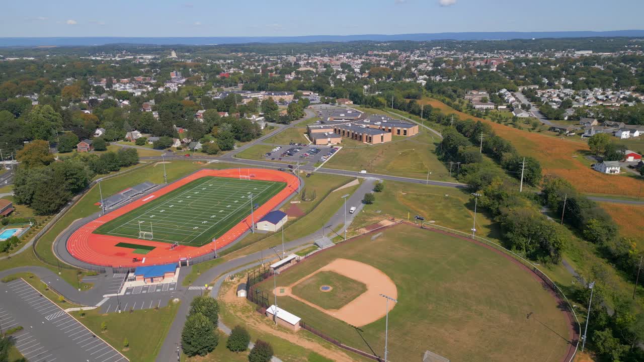 Aerial drone video of athletic fields and school