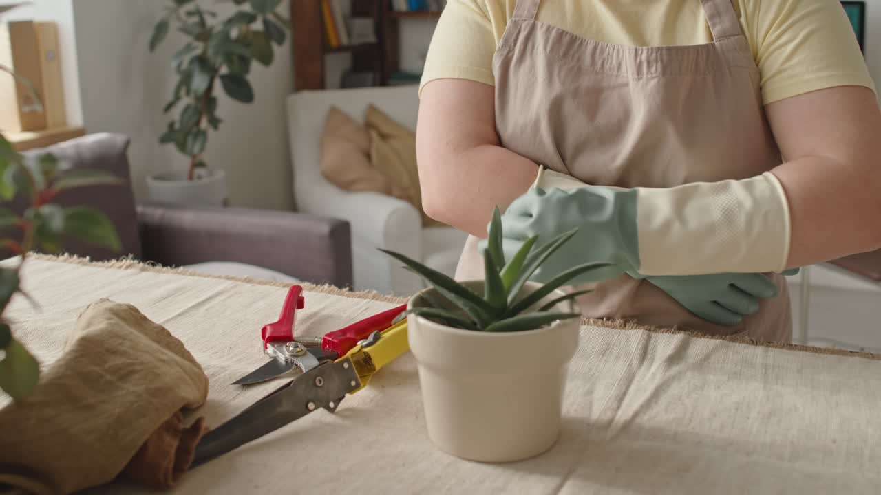Woman with Down syndrome wearing rubber gloves