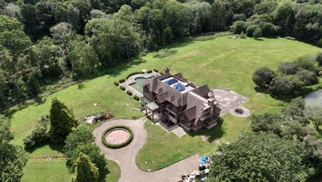 secluded luxury celebrity real estate aerial view surrounded by lush overgrown uk woodland uk