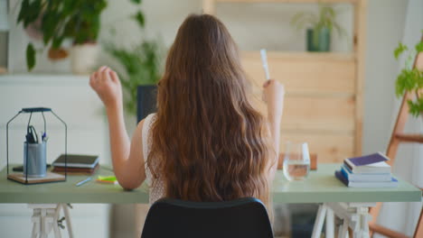 back view woman video conference