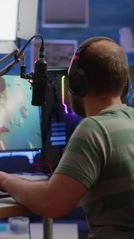 male gamer reacting to gameplay on his pc setup
