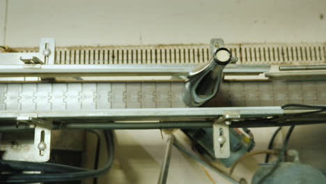 wine bottles closed with a cork stopper move along the conveyor belt view from above