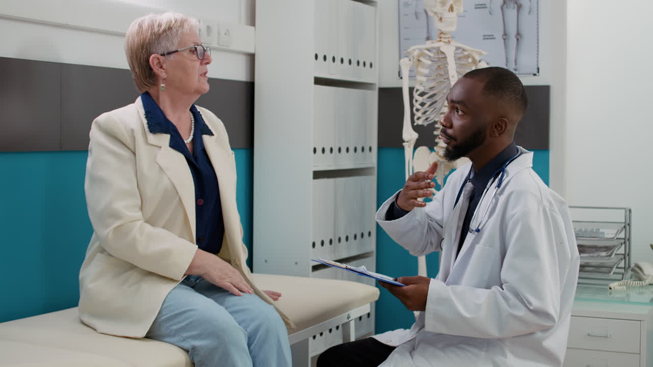 Doctor examining elderly patient in clinic