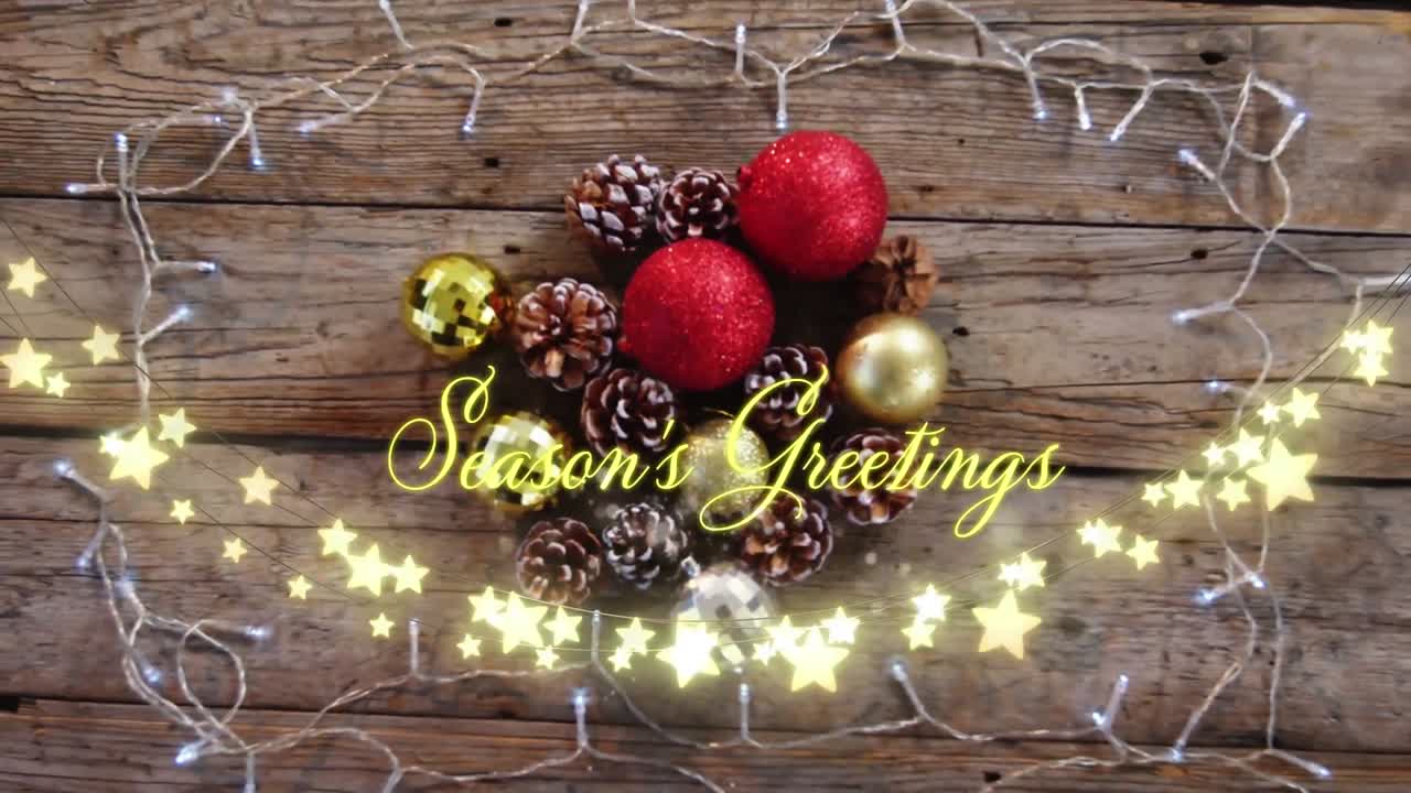 Animation of text, season's greetings, in yellow, over star string lights and christmas decorations