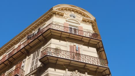 ornate corner building with balconies