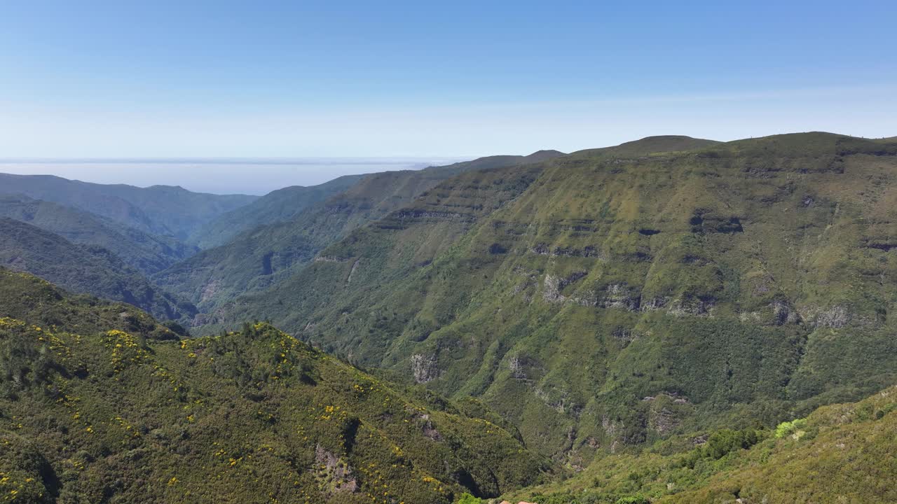 Hiking trails and lush vegetation along interior mountains of Madeira, aerial