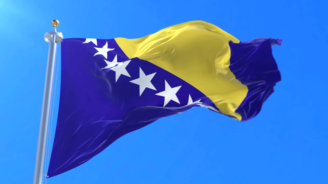bandera de bosnia y herzegovina agitando en el viento en lento con cielo azul, bucle