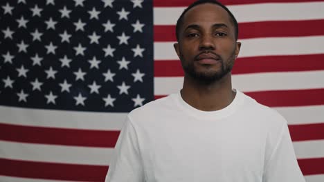 portrait video of black man on american flag background