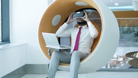 young businessman in vr headset