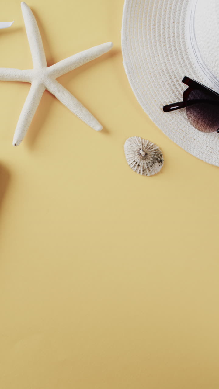 Close up of white airplane model, shells, smartphone and copy space on yellow background