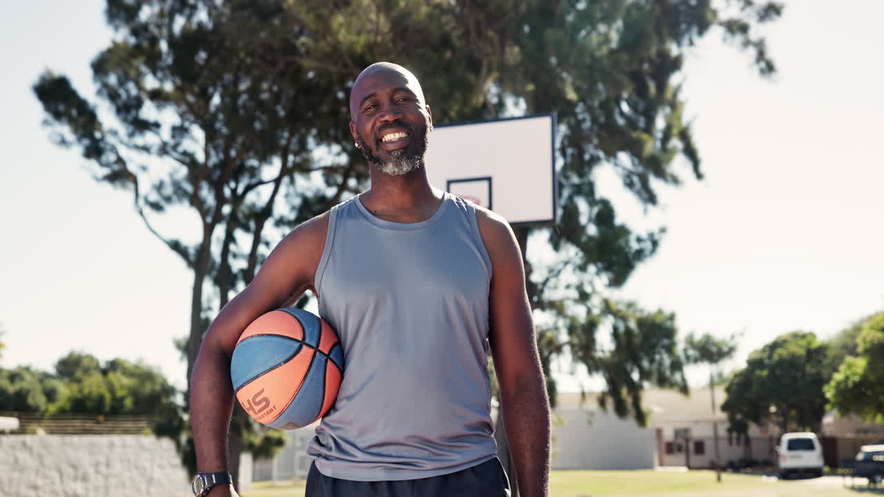 Man with basketball outdoors