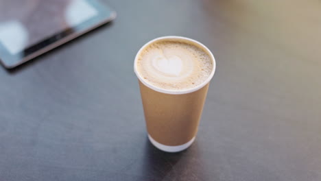 coffee, takeaway and heart in a disposable cup