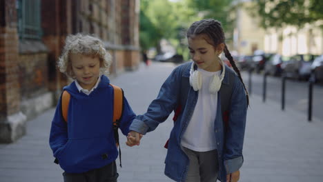 children walking hand-in-hand