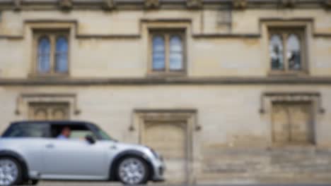 defocused shot of traffic and people travelling down high street in oxford 02