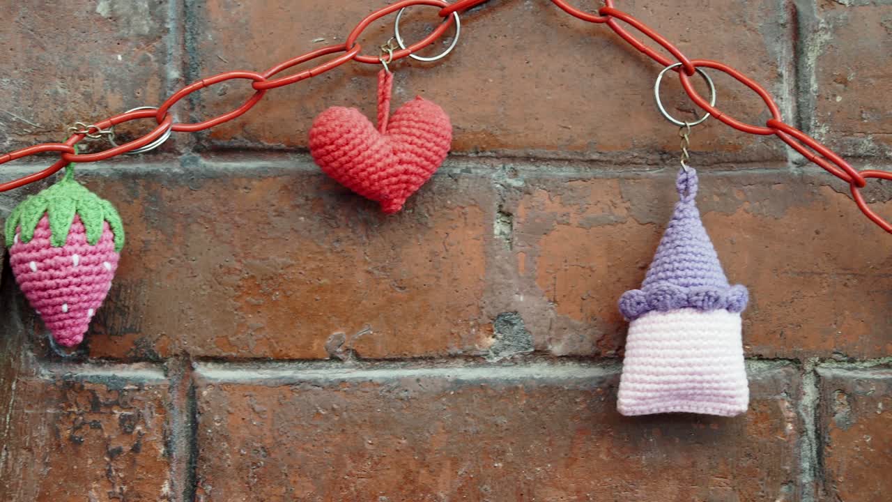 Crochet Keychains on Brick Wall