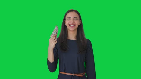 Happy-Indian-girl-using-money-as-fan-Green-screen