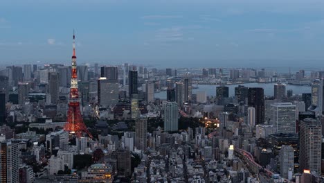 beautiful 4k time lapse over tokyo cityscape at dusk illumination lighting up with tokyo tower