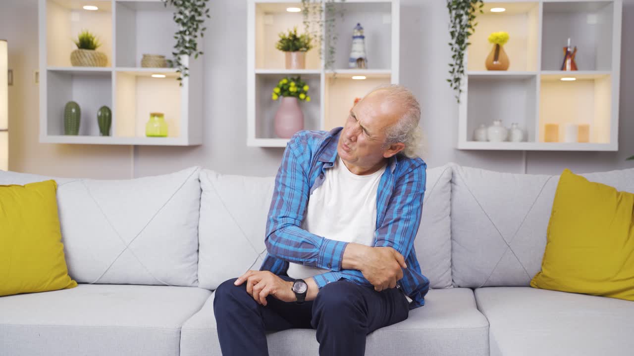 Old man with aches and pains in his joints.