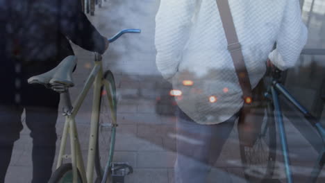 animation of cars over diverse people walking with bikes