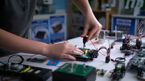person working on electronic circuitry and prototyping