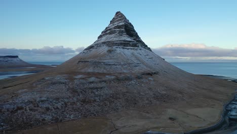 An-orbiting-aerial-view-shows-Kirkjufell-Mountain-on-Sn_fellsnes-Peninsula-Iceland