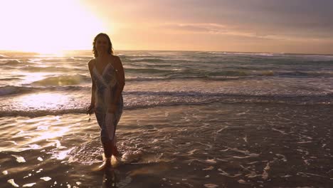 slow motion silhouette shot of a beautiful young women walking on the beach during sunrise on the beach in the gold coast of australia