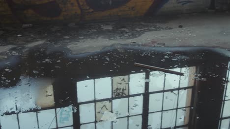 puddle of water in abandoned chicago warehouse